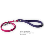 Close up of a biothane purple and magenta rolled dog leash with standard handle and chrome-plated trigger snap