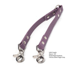 Mauve BioThane waterproof coupler with chrome-plated trigger snap and nickel-plated hardware on a white background