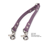Mauve BioThane waterproof coupler with chrome-plated trigger snap and nickel-plated hardware on a white background