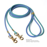 Biothane rolled leash in periwinkle and dusty turquoise with solid brass trigger snaps on a white background