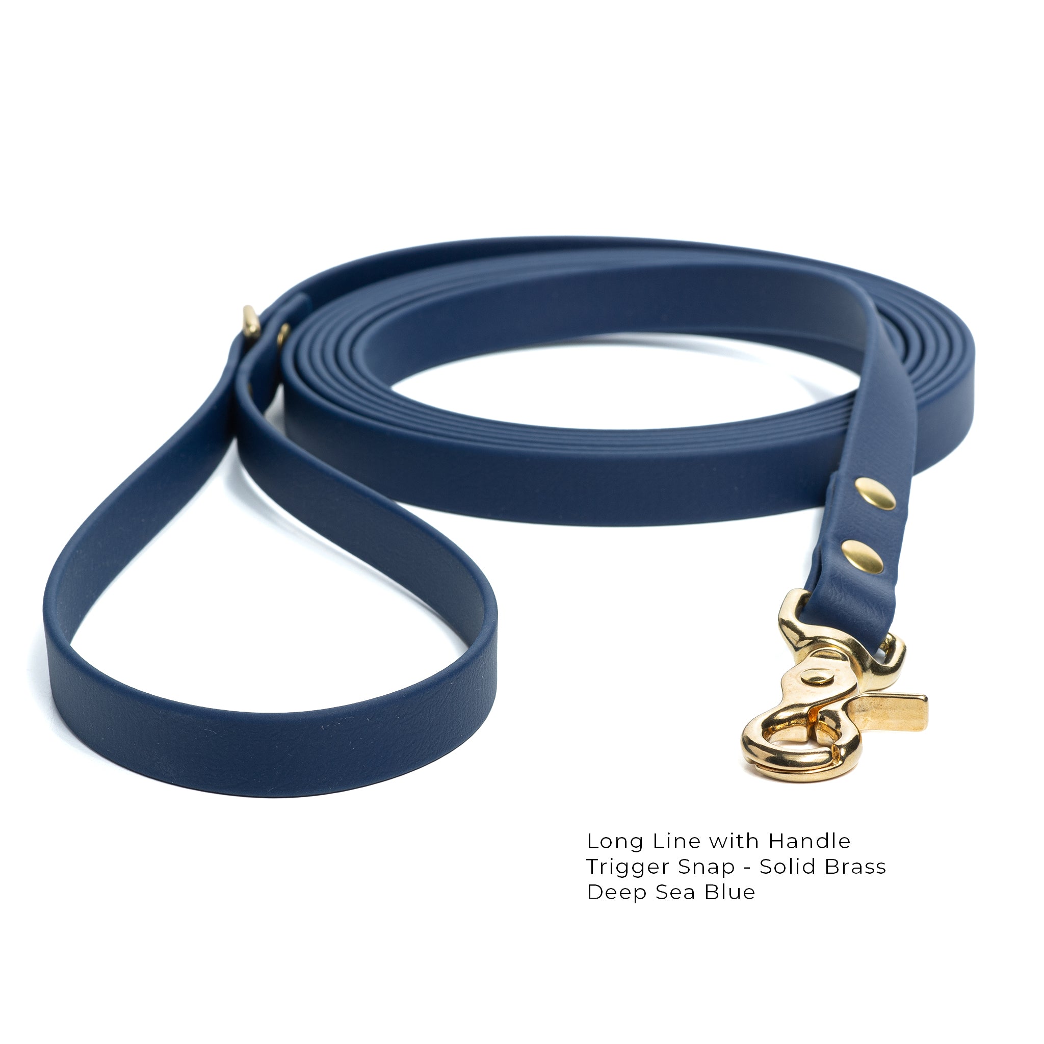 A deep-sea blue biothane lone line with a handle and solid brass trigger snap  coiled on a white background.