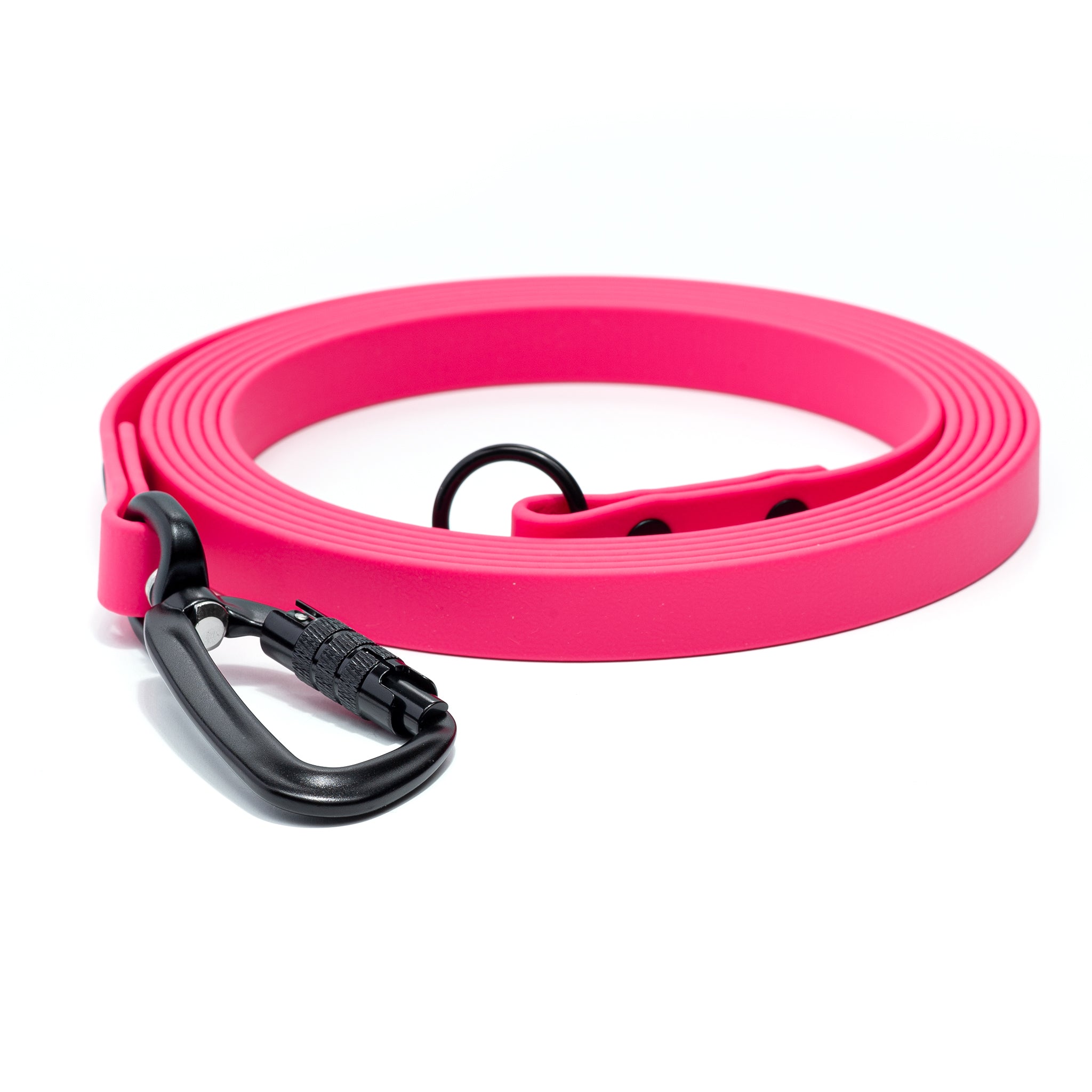 A passion fruit biothane lone line with an O-ring and matte black carabiner coiled on a white background.