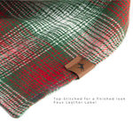 Vivid Canine Blurred Red Plaid dog bandana up-close showing faux leather label and top stitching detail