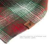 Vivid Canine Blurred Red Plaid dog bandana up-close showing faux leather label and top stitching detail